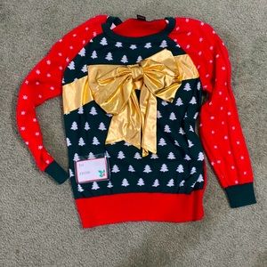 Cute red ugly Christmas sweater with gold lame bow.